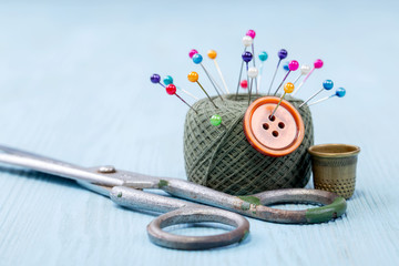 still life of spools of thread on a wooden background