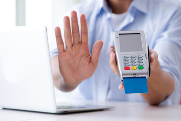 Man processing credit card transaction with POS terminal