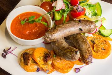 Fried sausages and salad