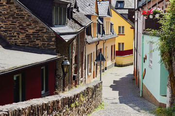 View of the narrow paved street and medieval houses
