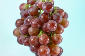 Red grapes on white background.
