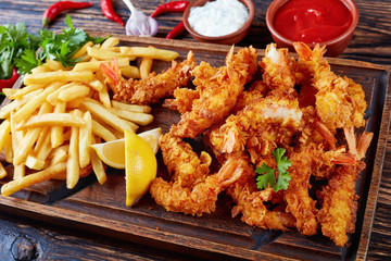 shrimps with french fries and sauces