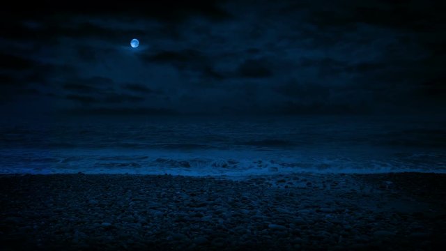 Rocky Beach With Waves Splashing At Night