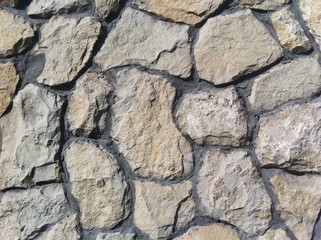 Decorative natural stone. Natural decoration of the facade of the house, building