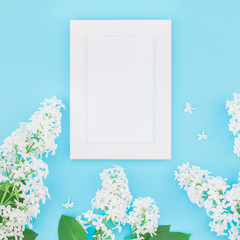 Blank frame mockup with white flowers