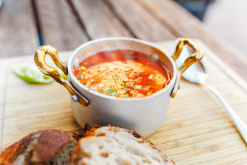 Traditional Hungarian goulash soup with a beautiful serving in the national restaurant. The concept...