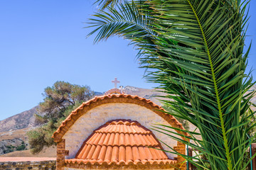 Church, Greece, Kos Island: old cozy little orange stone church with red roof chapel in traditional...