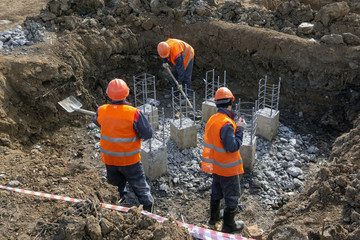 workers at the construction site take out the garbage