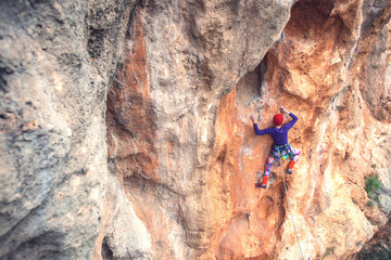 A rock climber on a rock.