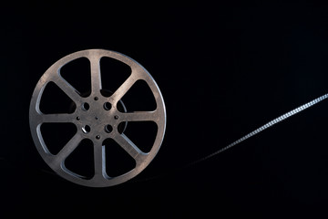 Naklejka premium Movie film reel on dark