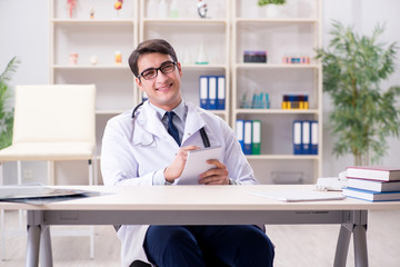 Young doctor sitting in the office