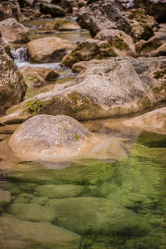 Landscape - forest, rocks and mountain river.