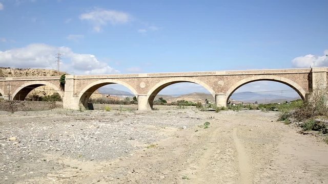 ancient bridge over Andarax dry river next to Rioja village, Almeria, Spain