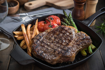 grilled rib eye steak on pan