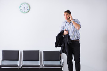 Man nervously impatiently waiting in the lobby