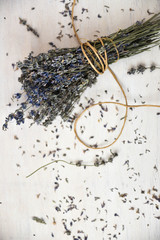 Dried lavender on wooden table. Traditional lavender flower drying.
