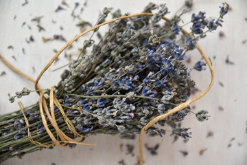Dried lavender on wooden table. Traditional lavender flower drying.