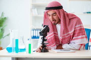 Arab chemist working in the lab office