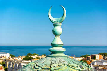 Crescent moon steeple on top of the Grand Mosque, in Constanta, Romania. Symbol for the Ottomans it...