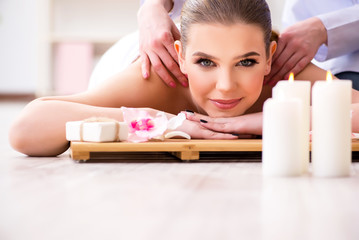 Obraz na płótnie Canvas Young woman during spa procedure in salon