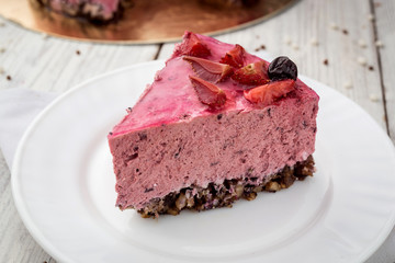 Strawberry Cake dessert with vanilla cream on wooden background