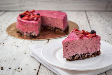 Strawberry Cake dessert with vanilla cream on wooden background