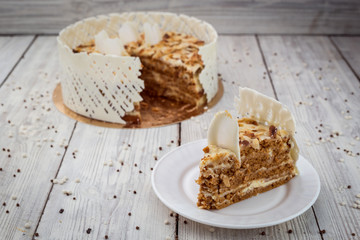 White Chocolate vegane cake with nuts and cream. Birthday concept