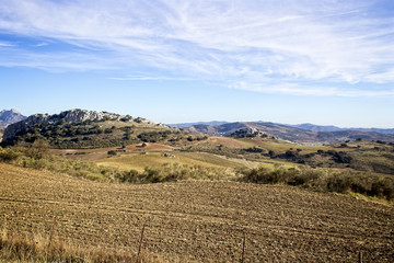 Fototapeta na wymiar A view across farmland in the Sierra de las Cabras, Malaga, Andalucia, Spain.