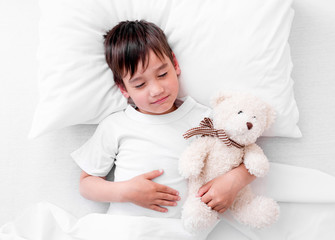 Toddler boy sleeping with teddy bear © tan4ikk