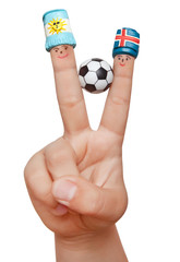 Two fingers in plasticine fan hats with a soccer ball isolated on white background. Fans of Argentina and Iceland.