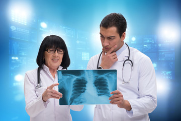 Two doctors discussing x-ray image in telemedicine concept