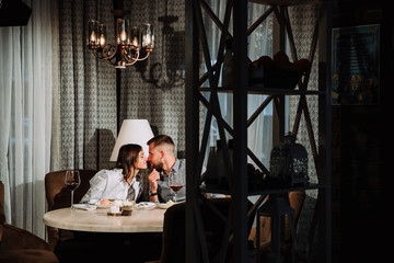 Young couple in restaurant enjoying the time in holiday