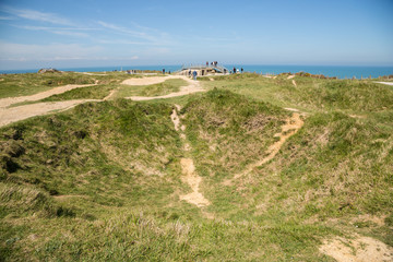Tourists at the German bunkers at Pointe Du Hoc, Normandy, which were captured by the US Rangers on...