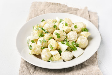 Potato salad with eggs and green onion