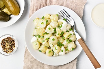 Potato salad with eggs and green onion