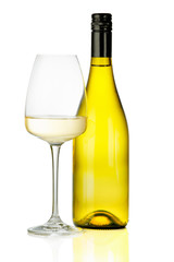 A glass of white wine and a bottle.
