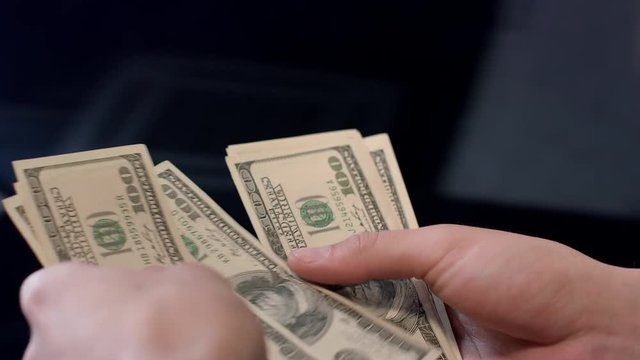 Woman counting dollar banknotes. Personal expenses, money calculation. Hands count money. Financial cash operations concept. Close up of woman hands holding cash dollars