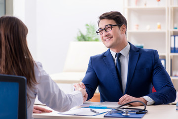 Man signing medical insurance contract