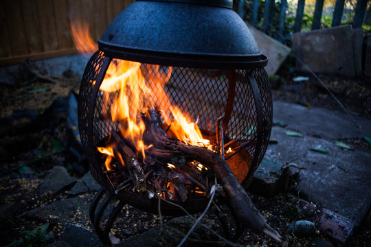 Burning fire flames in the nature. Preparing fire for barbecue. Fire flames in motion image. Danger concept with open fire flames. Preparing food outside in the nature.