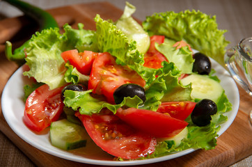 Raw salad of tomatoes, olives and cucumbers