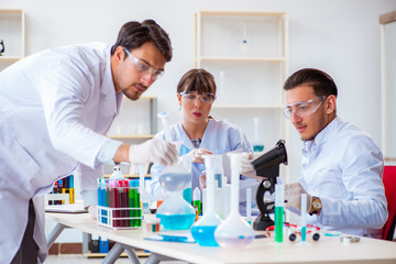 Team of chemists working in the lab