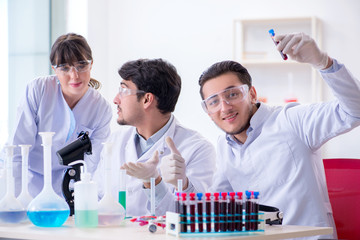 Team of chemists working in the lab