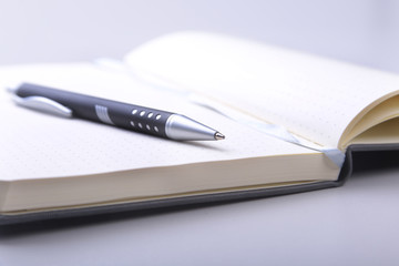 Naklejka premium office table with notebook and pen. copy space.