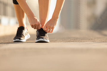 Runner tying shoelace. 