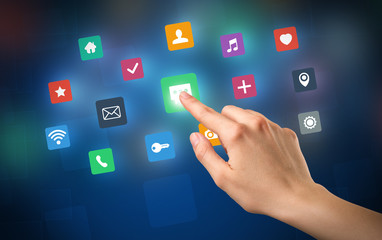 Female hand touching colorful applications 