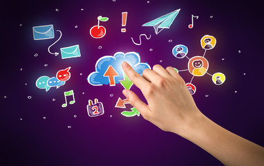Female hand toucing mixed media icons with purple background