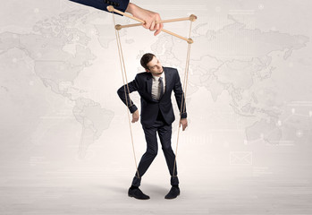 Puppet man with big city great power concept
