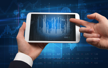 First person hand using tablet and checking financial report on cloud computing system
