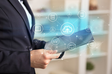 Business woman using tablet with network security and online storage system concept
