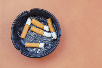 ashtray with cigarettes
